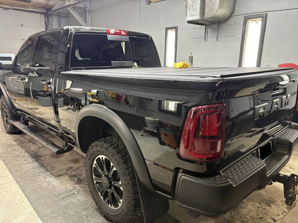 Glossy black Ram truck after ceramic coating